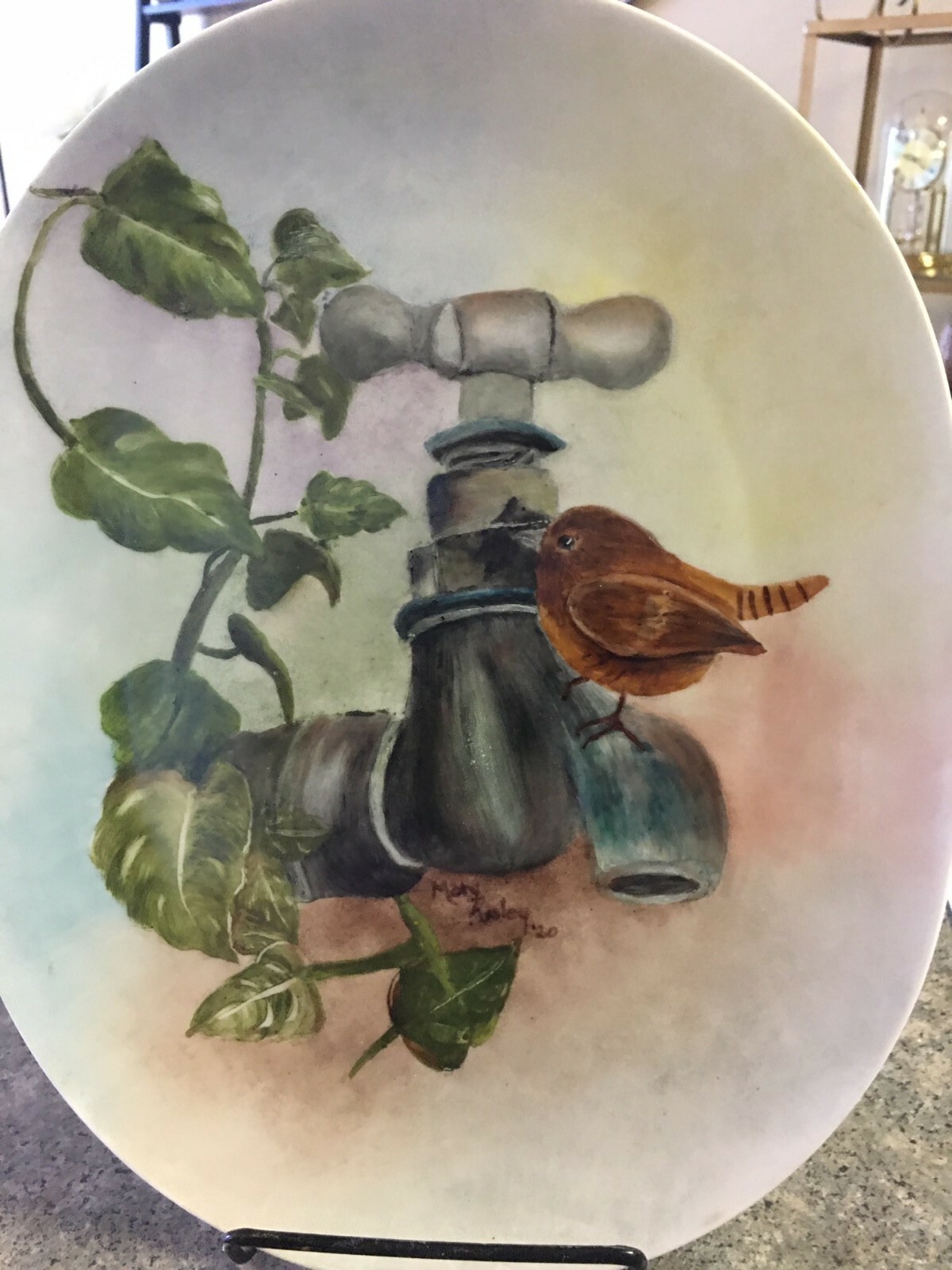 Hand painted china plate. Bird on Rusted Faucet. 6″ x 9″ oval. Dishwasher safe