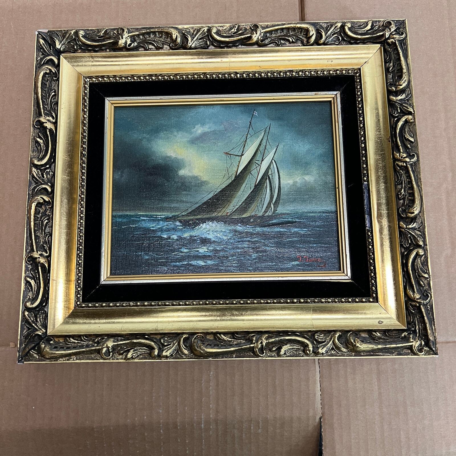 Seascape with sail boat, oil painting, signed J. James at lower right, framed