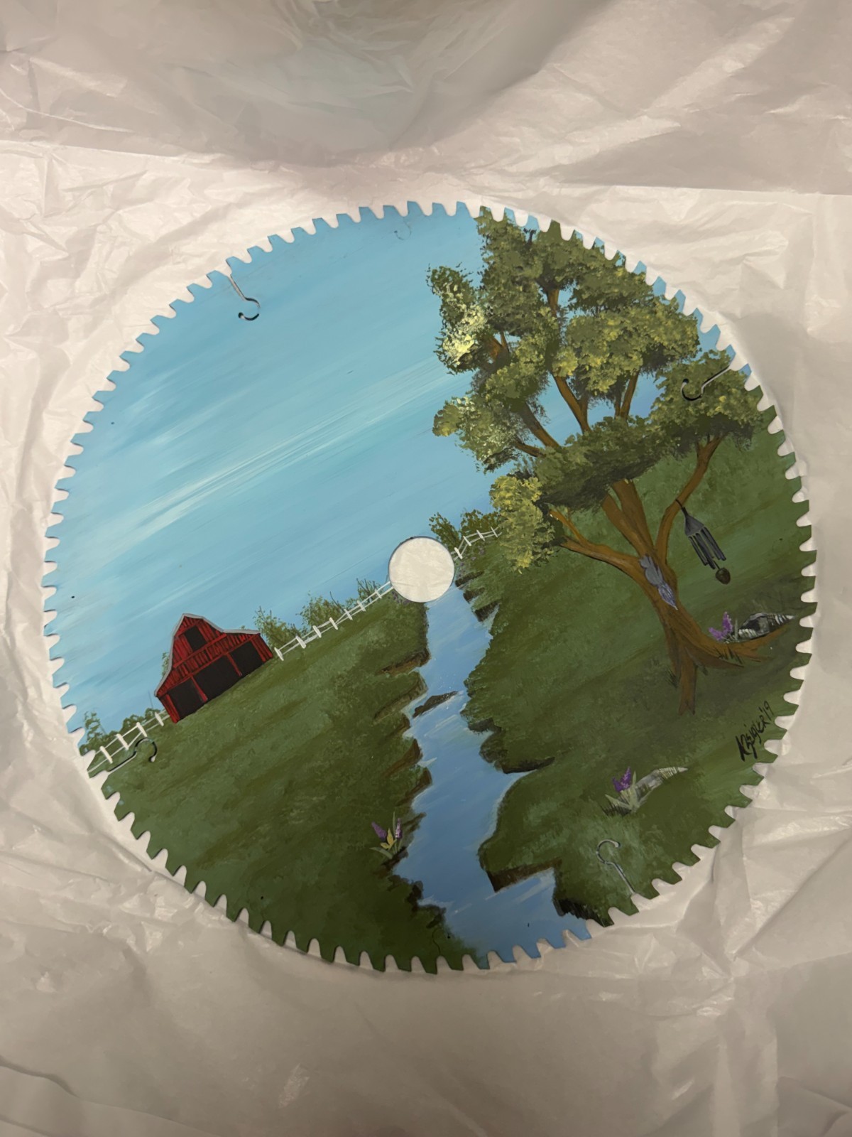 Round red barn painted sawblade
