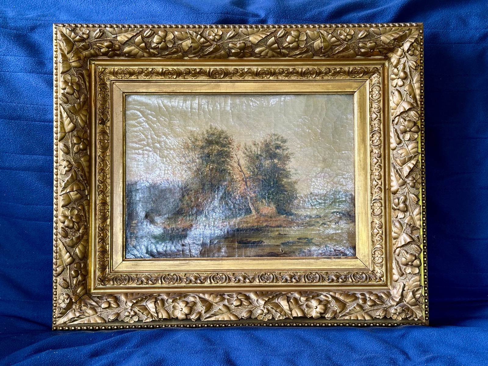 Antique 19th-century Victorian landscape oil painting featuring gilt gold frame