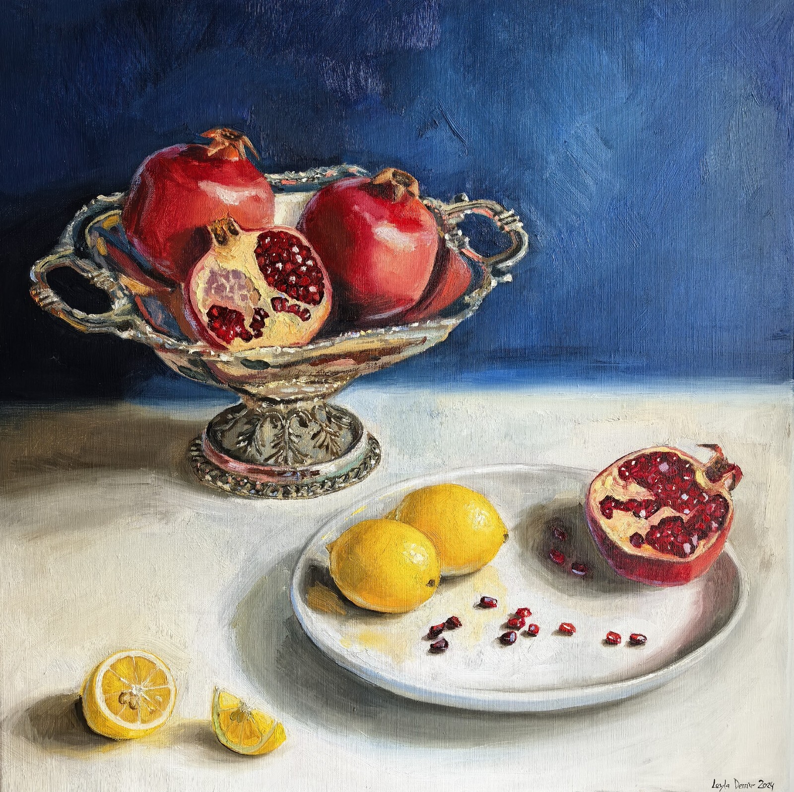Pomegranate in decorative metal bowl still life