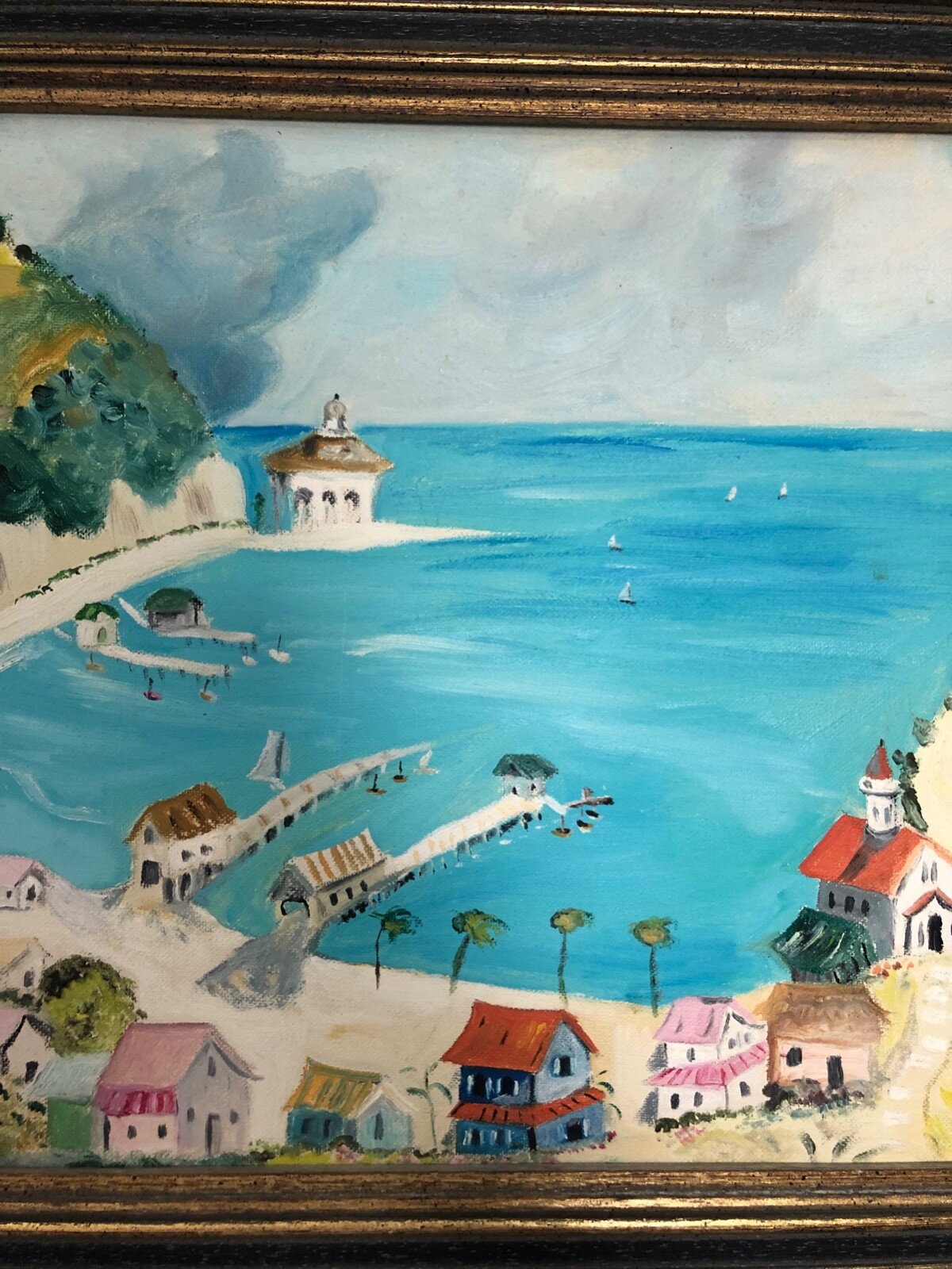 Coastal small town Painting signed by Marcy – framed in good condtion dated 1970
