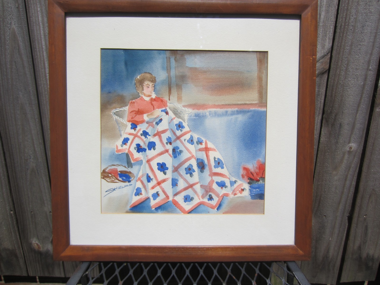 VTG~Watercolor Painting~Glass Front Framed/Matted Woman making Quilt~SHIELDS~17″