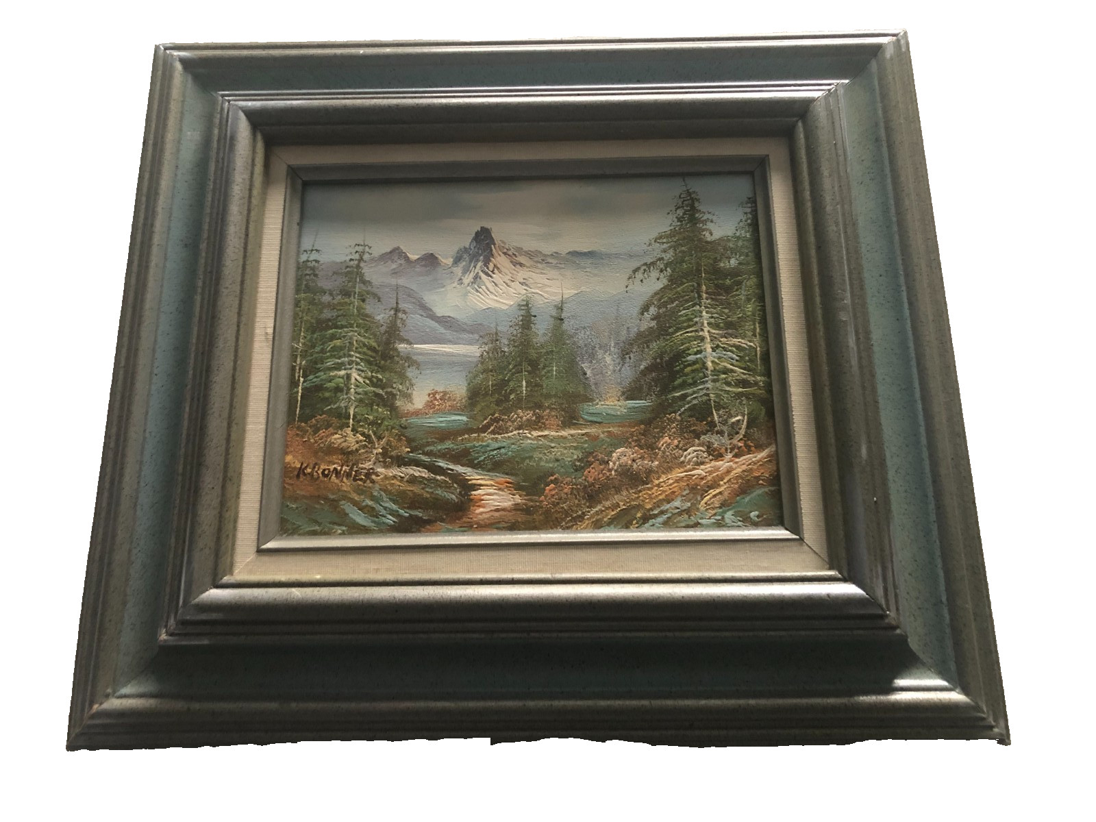 Vintage oil on canvas painting of mountain and river scene framd signed K Bonner