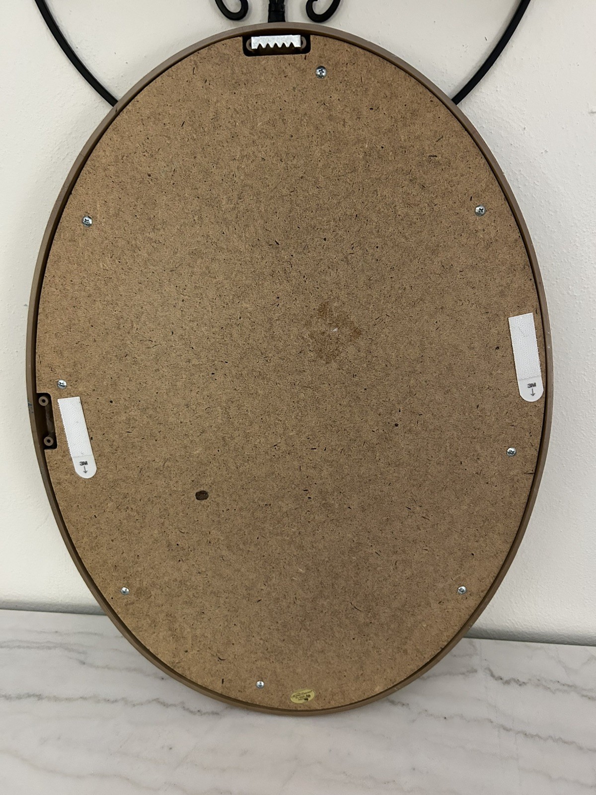 Elegant vintage oval-framed portrait featuring a Victorian-style lady
