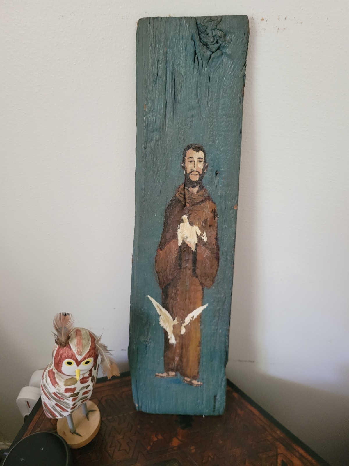 Painted on drift wood of monk and doves