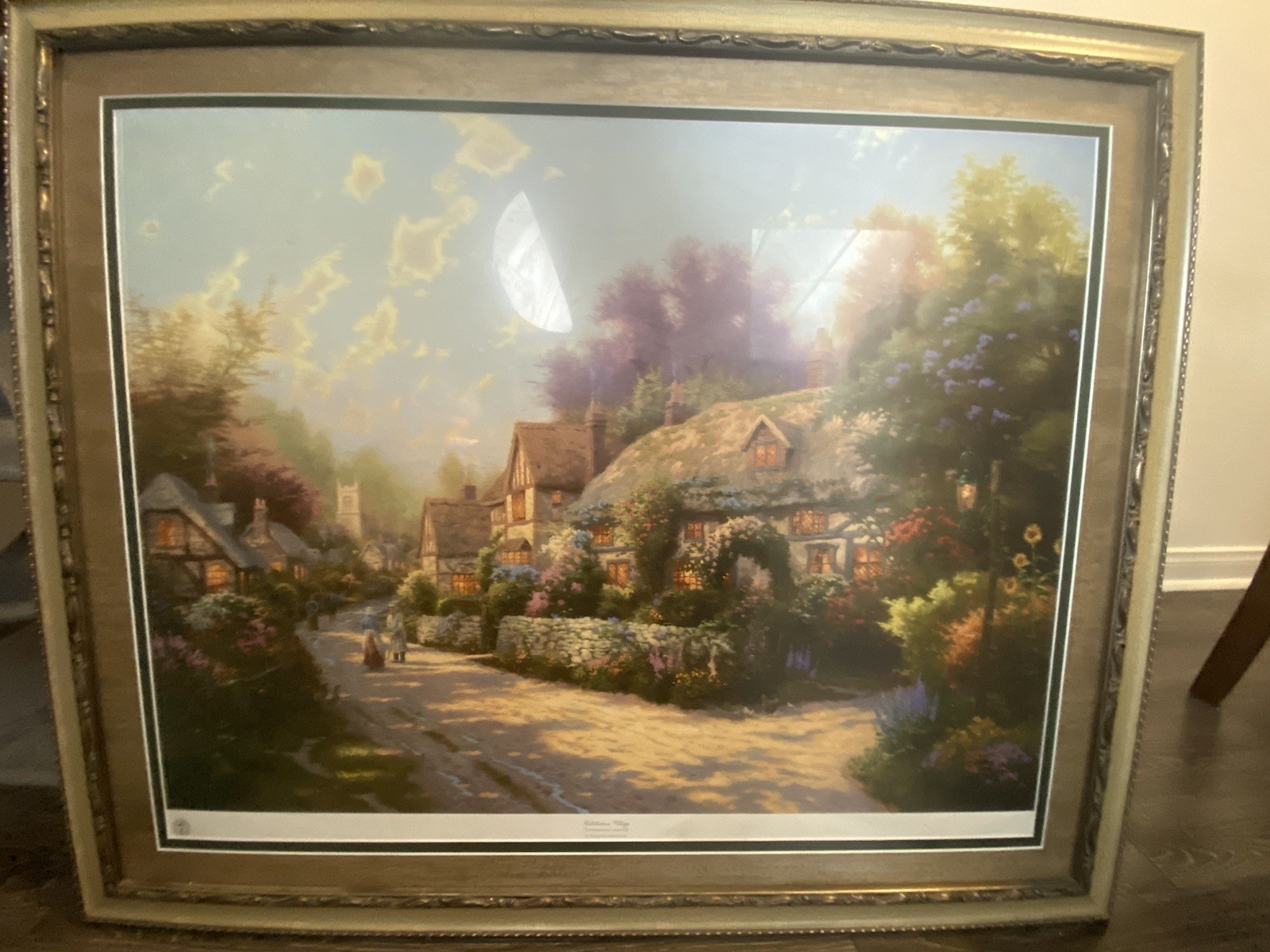«Cobblestone Village» is a painting by Thomas Kinkade /34 inches W x 28 Inches H