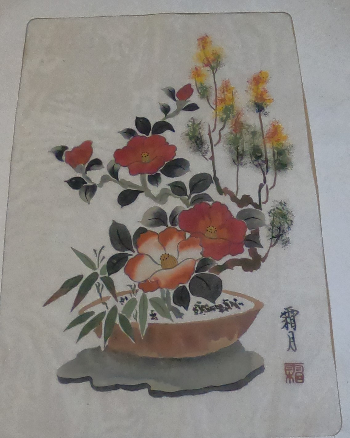 This traditional East Asian brush painting depicts camellia flowers on silk