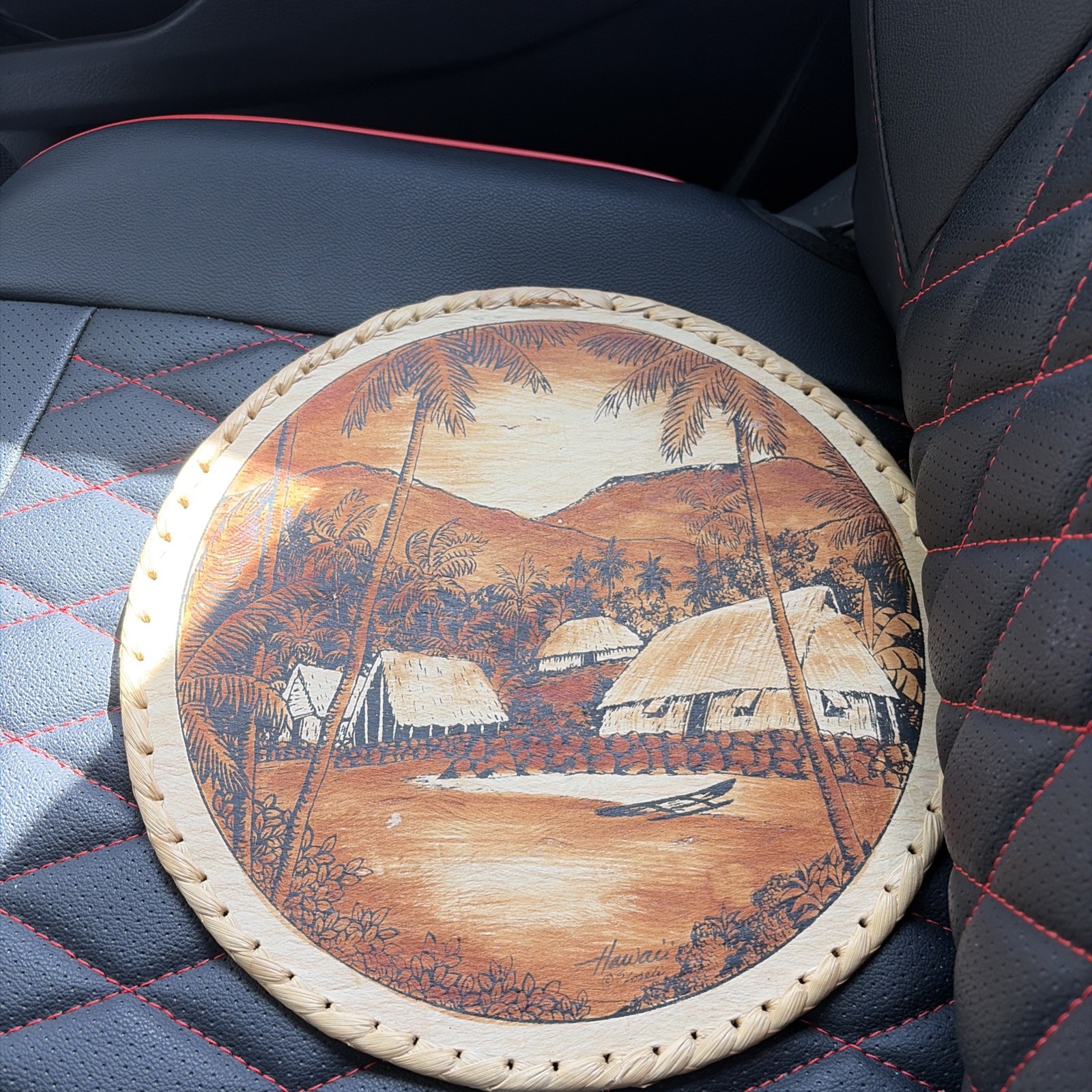A vintage Hawaiian pyrography wood-burned decorative plate.