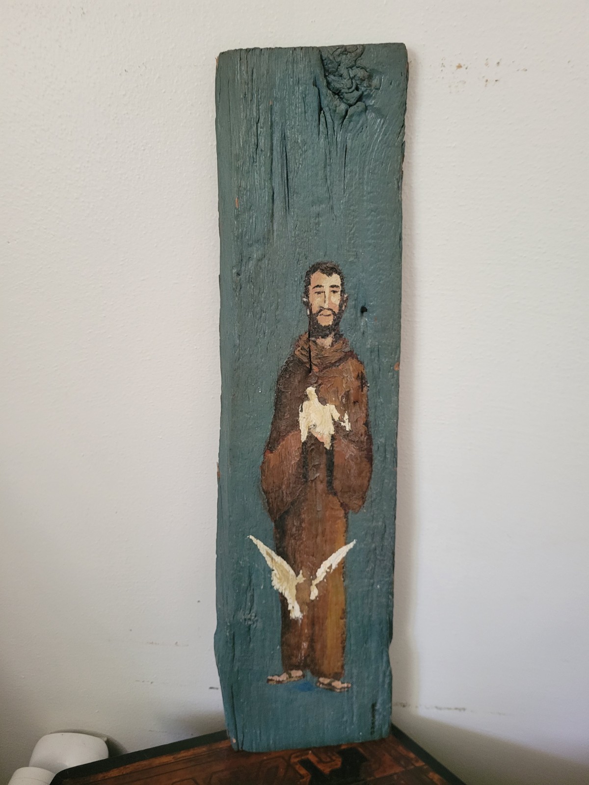 Painted on drift wood of monk and doves