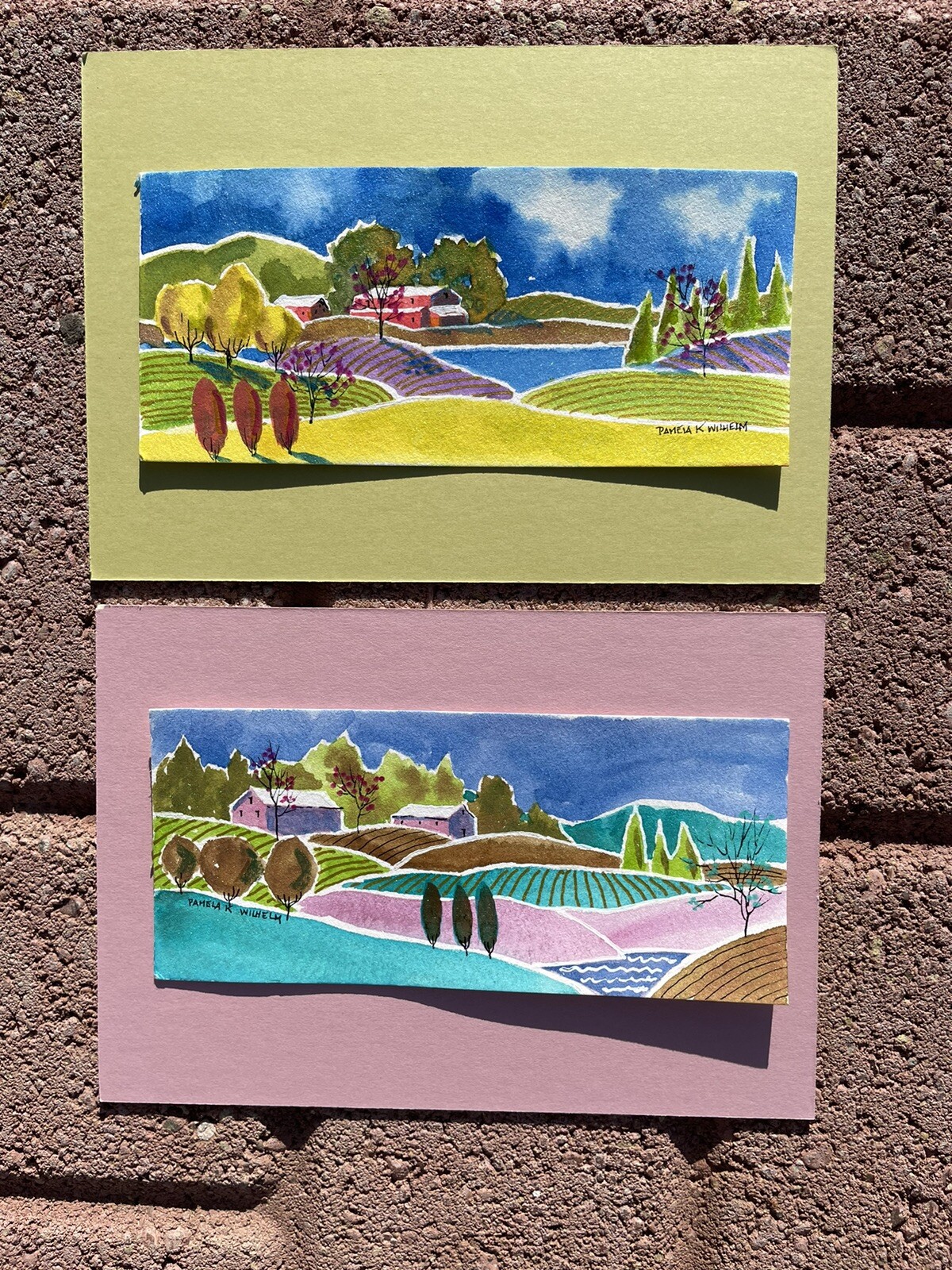 Pamela Wilhelm Two 2.5”x6” original Watercolors Whimsical Pink Barns Tree Fields