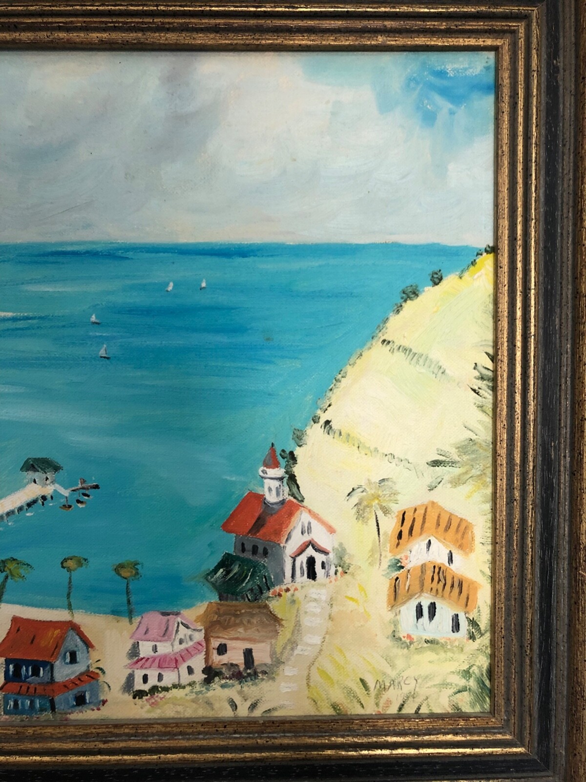 Coastal small town Painting signed by Marcy – framed in good condtion dated 1970