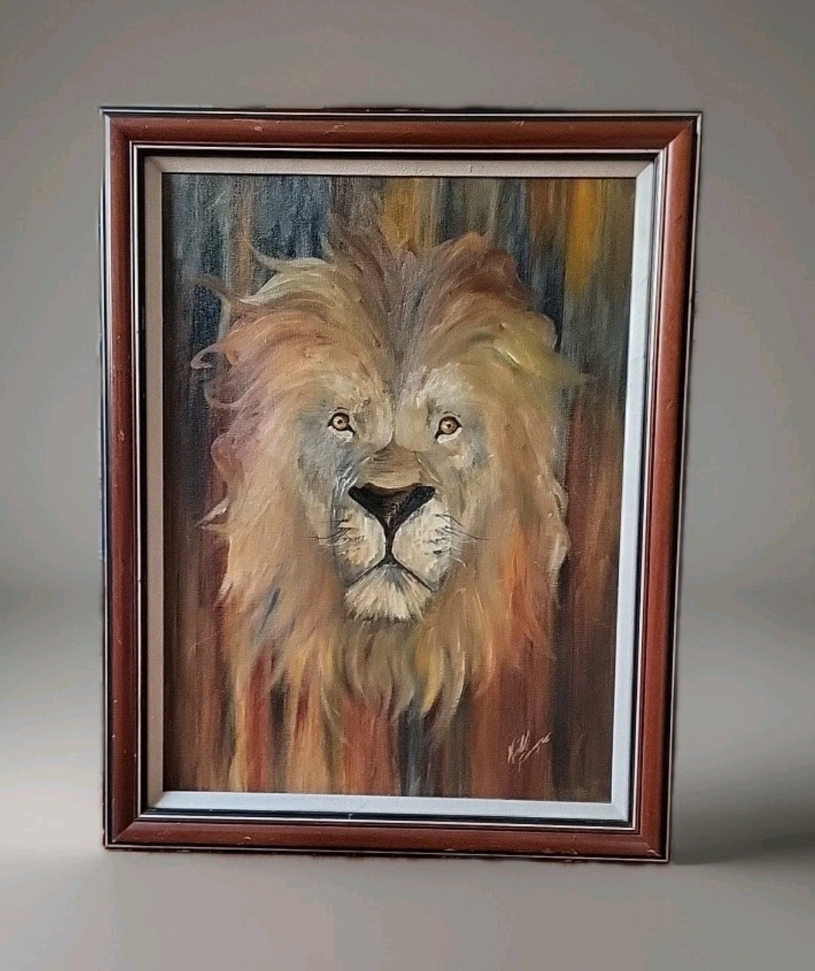 Oil painting of a lion’s head, framed, signed, 21.5″ x 28″