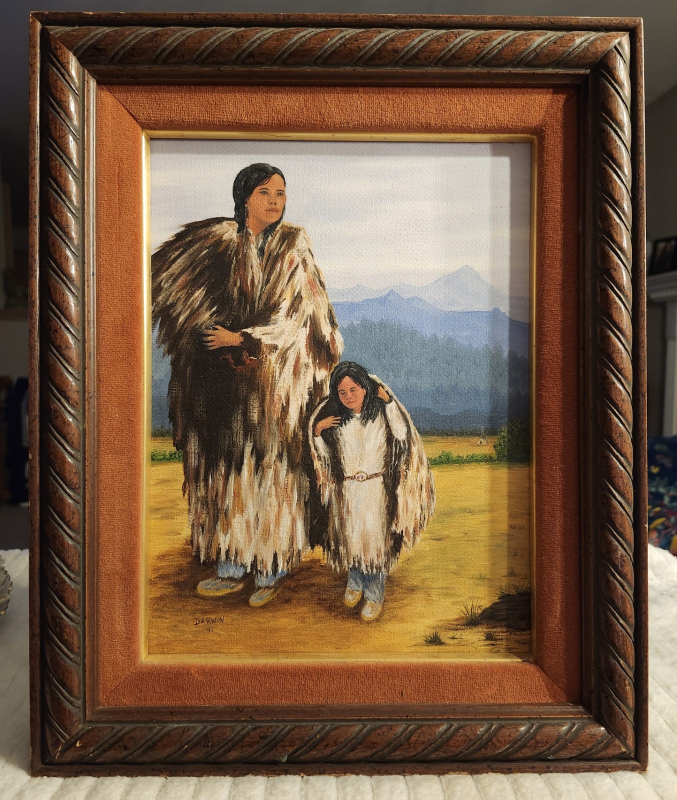 Oil painting of Native American mother and child by Darwin, dated 1991.