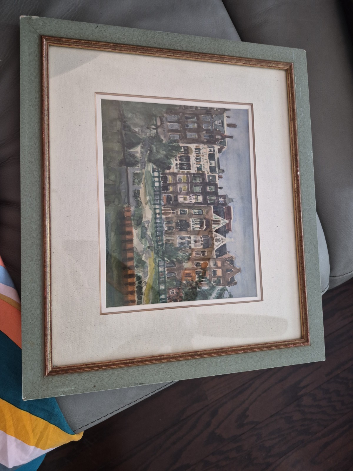 Vintage watercolor painting of a cityscape, possibly Netherlands or Amsterdam.