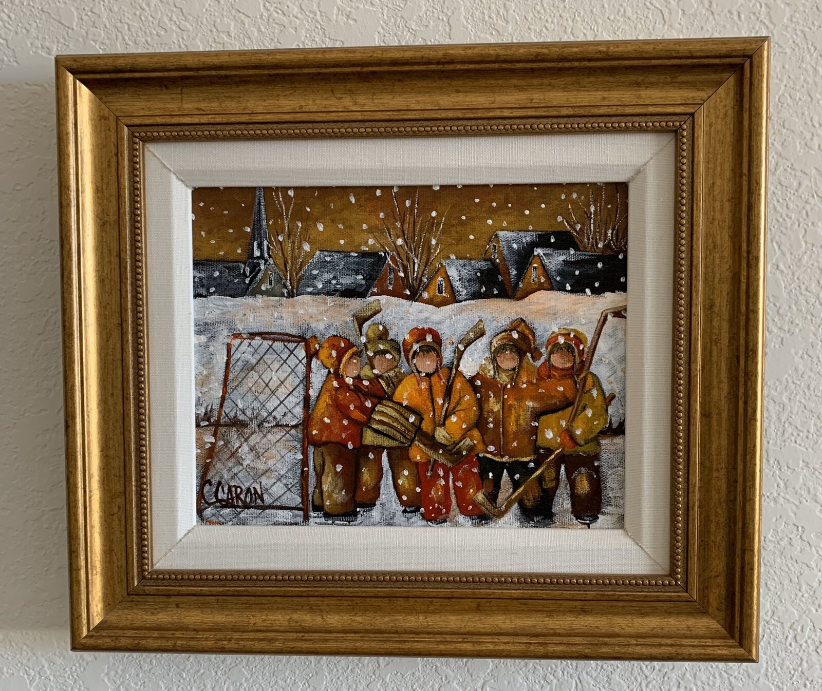 1950’S SUNSET WINTER SCENE OF YOUNG HOCKEY PLAYERS by C. CARON