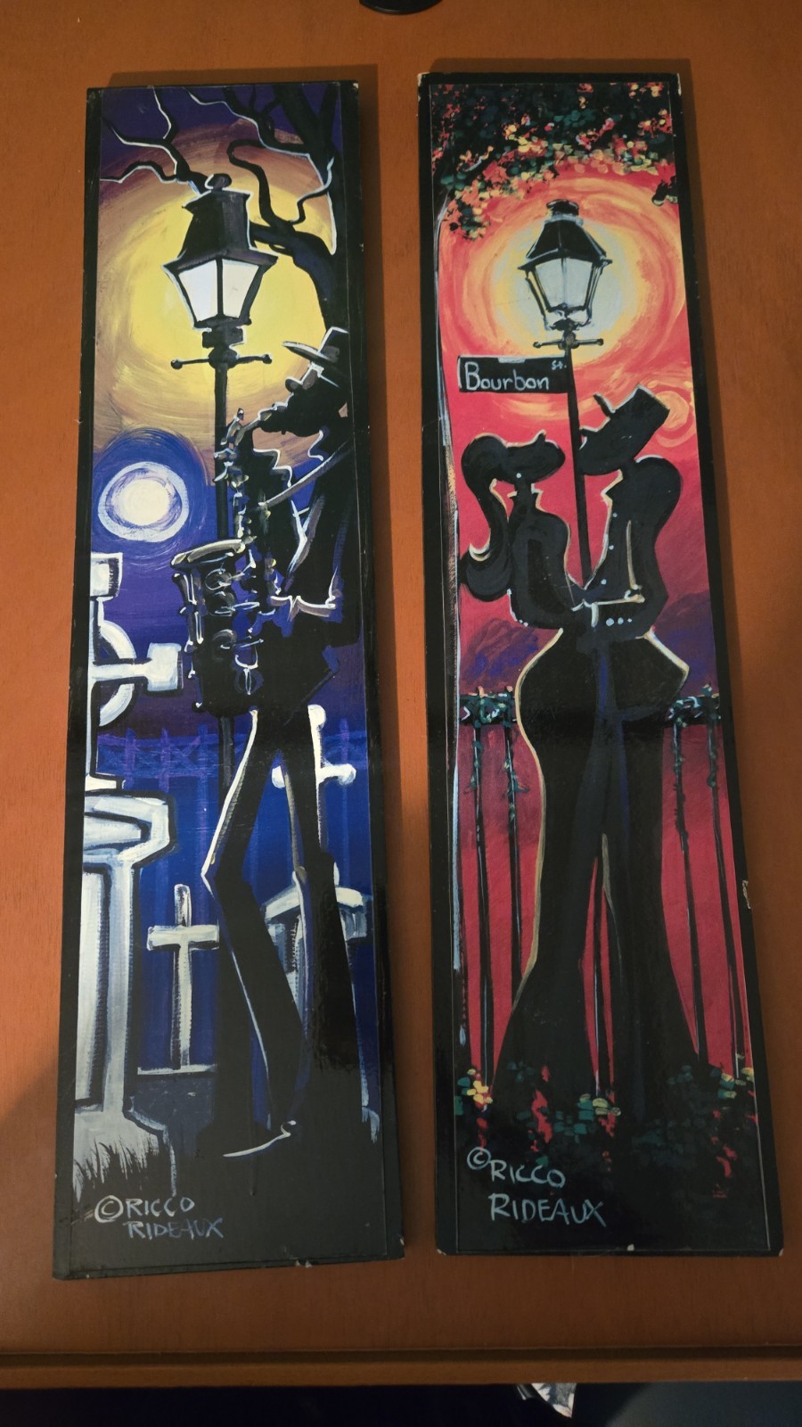 2 hand-painted wooden panels are by New Orleans street artist Ricco Rideaux.