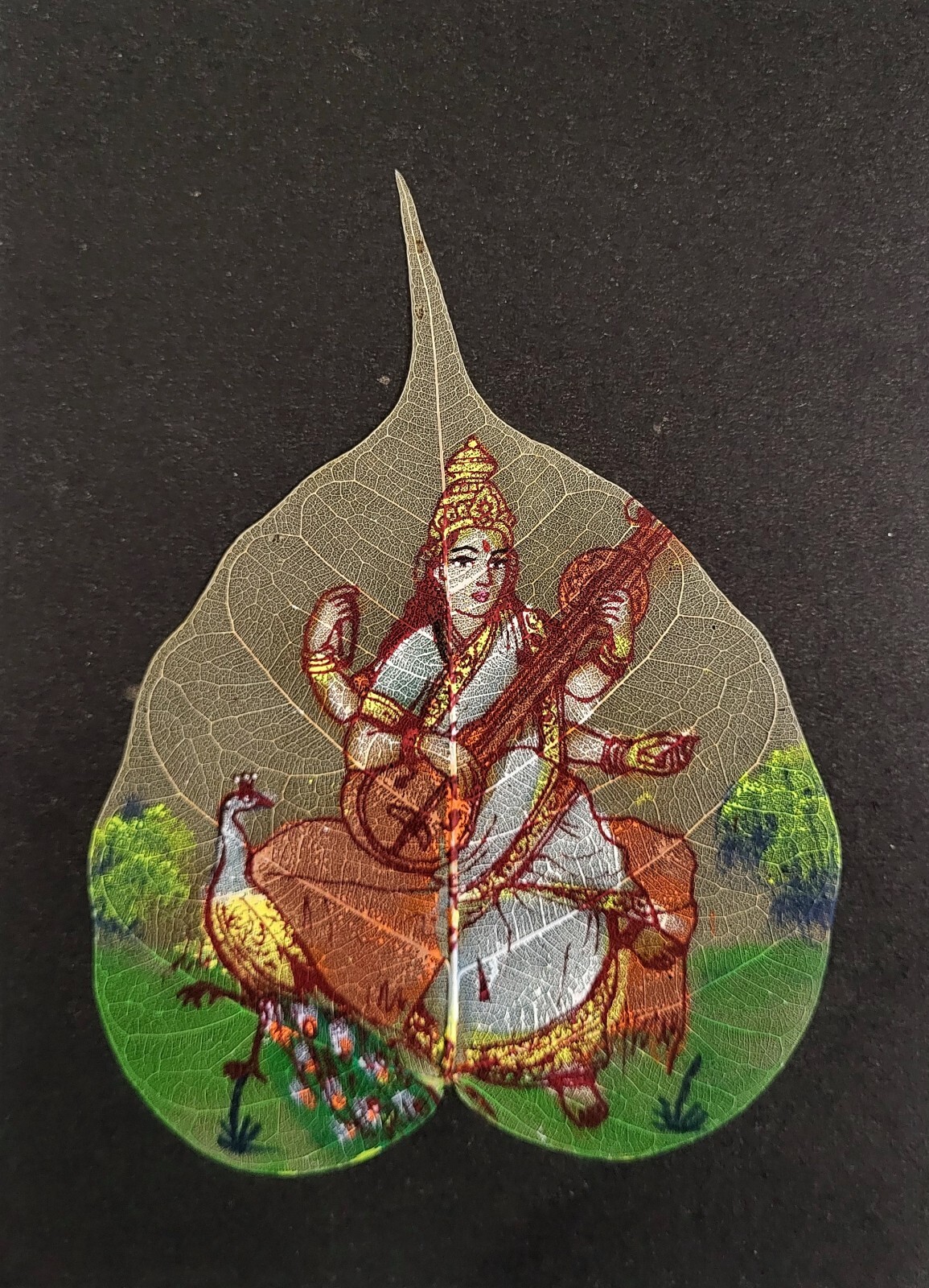 Indian Goddess Saraswati Handmade Leaf Painting – Pipal Leaf Art (9 * 6.5 inch)