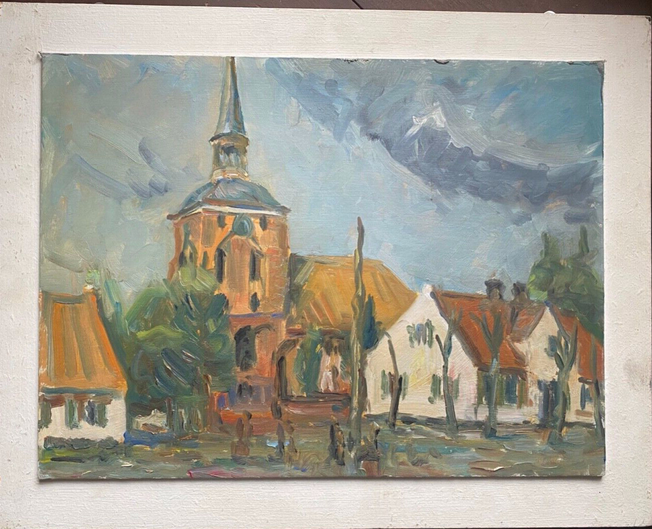 Oil painting village with church marketplace trees dark clouds