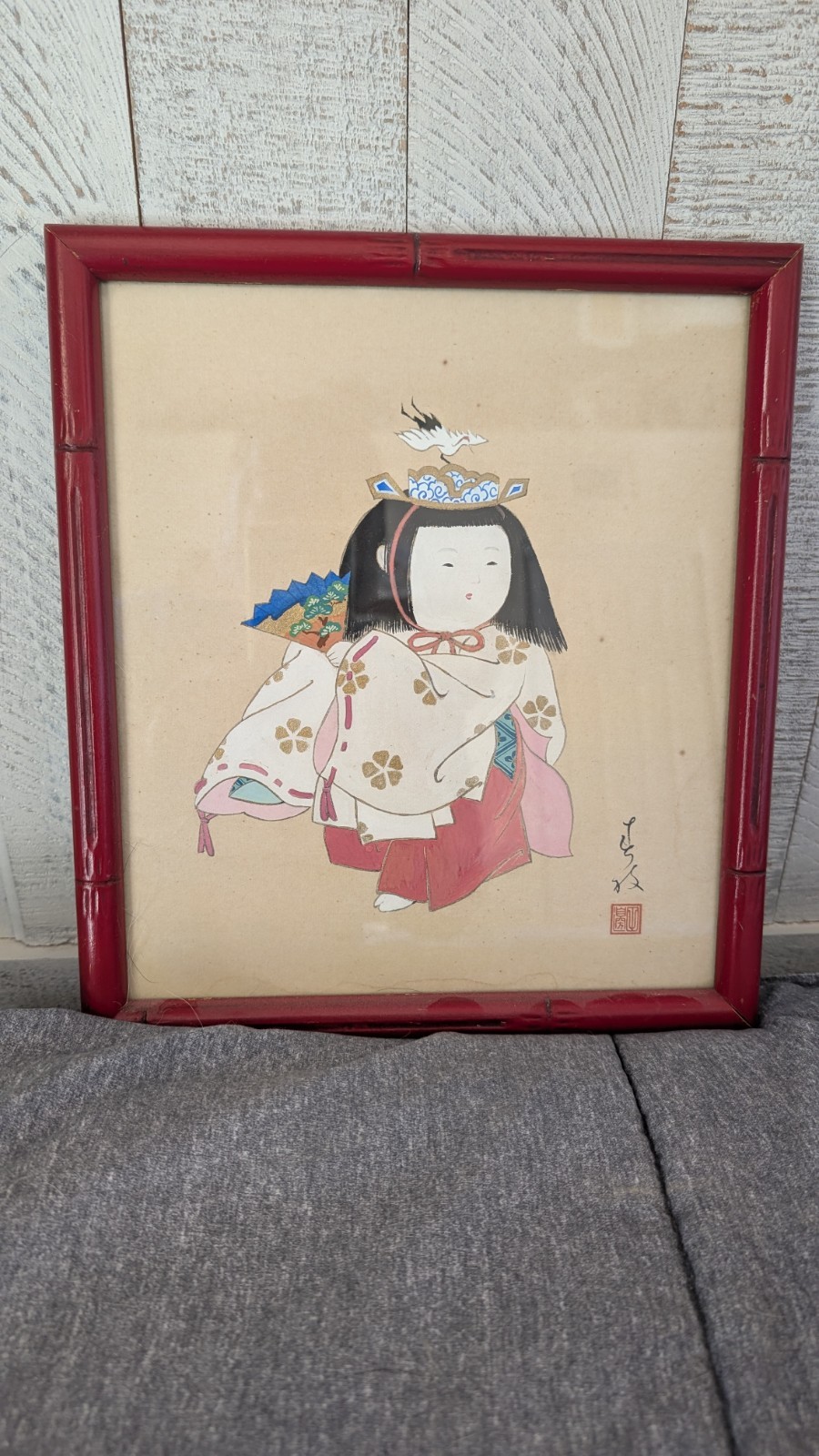 Framed Japanese painting of young girl, dimensions with frame are 12″ x 10 3/4″