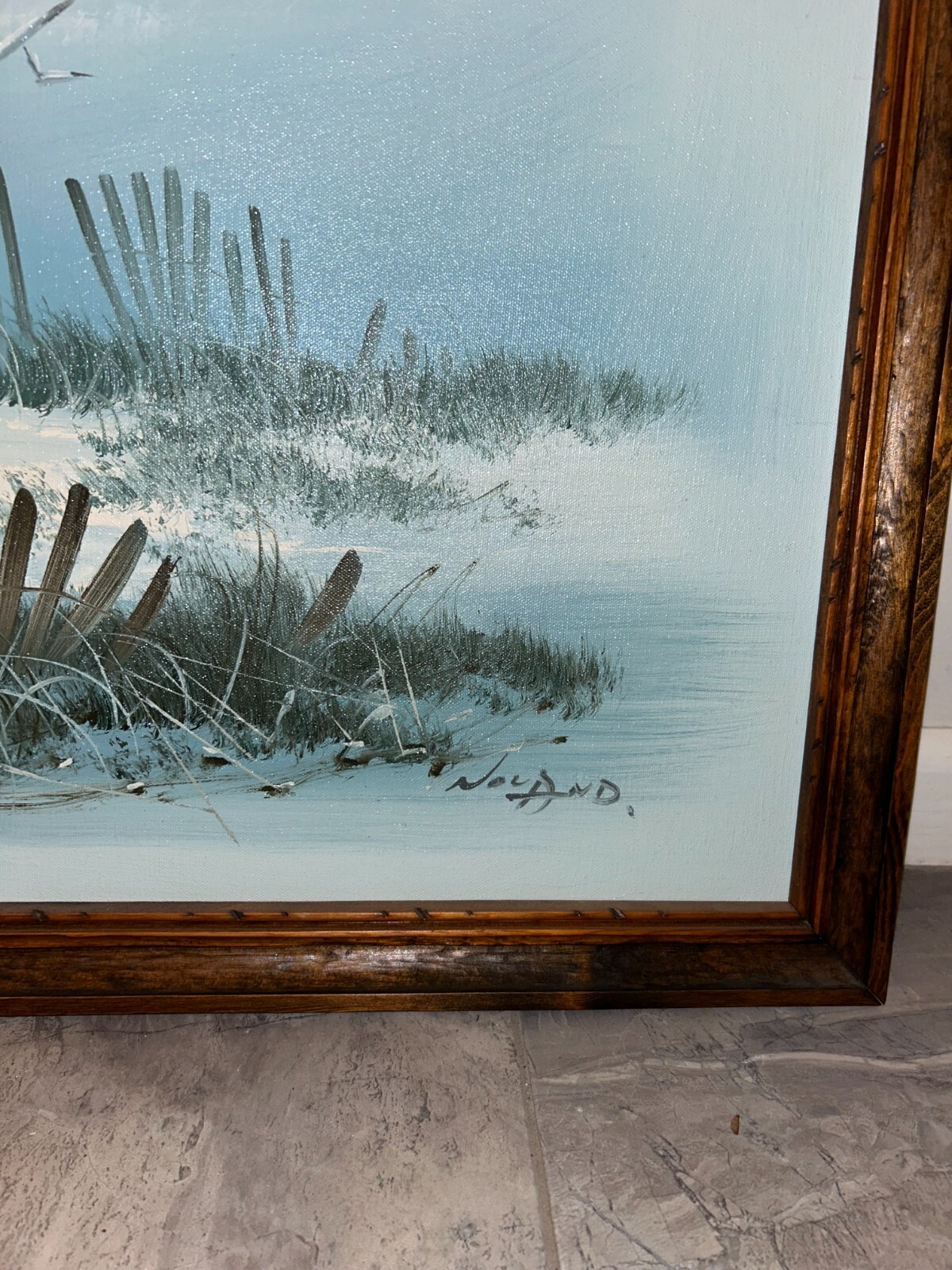 Beach view painting with a lighthouse fences and seagulls framed 26.5×51 in